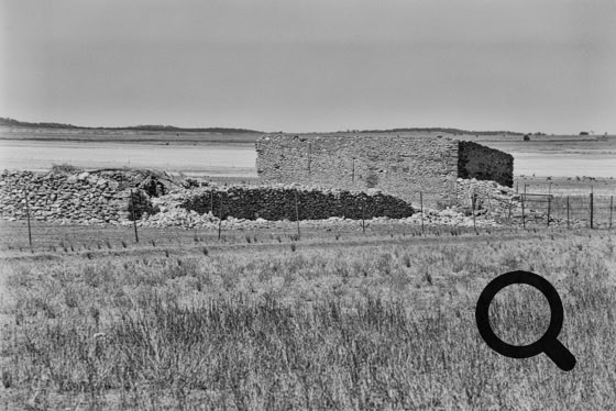 Large ruined work building behind the farm house.